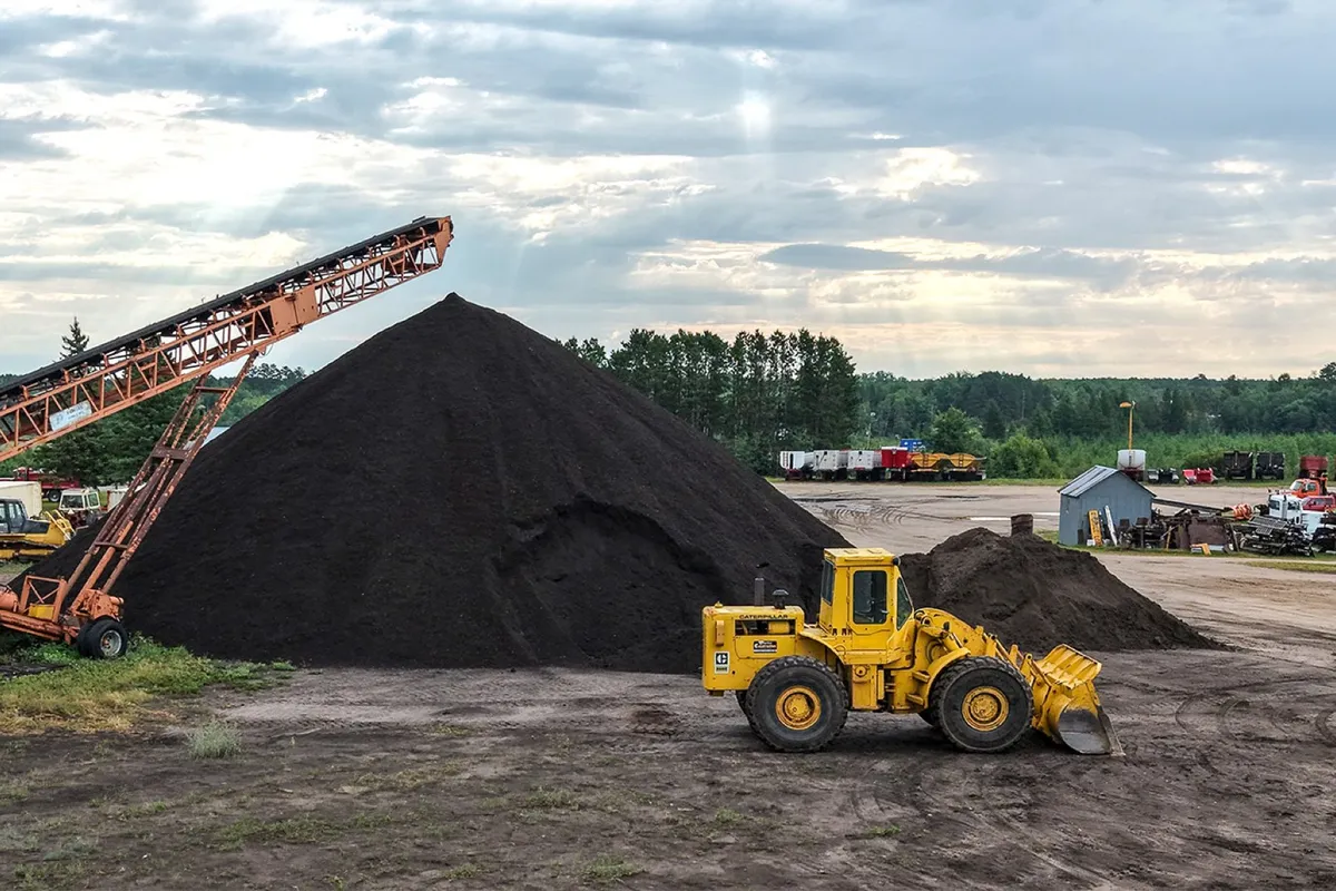 A wheel loader moving topsoil